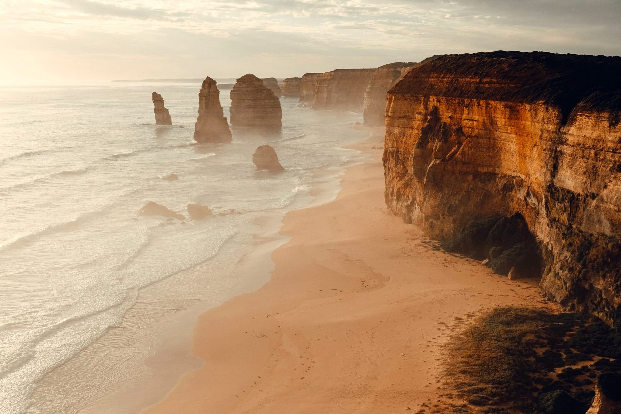 brown rock formation on sea shore during daytime